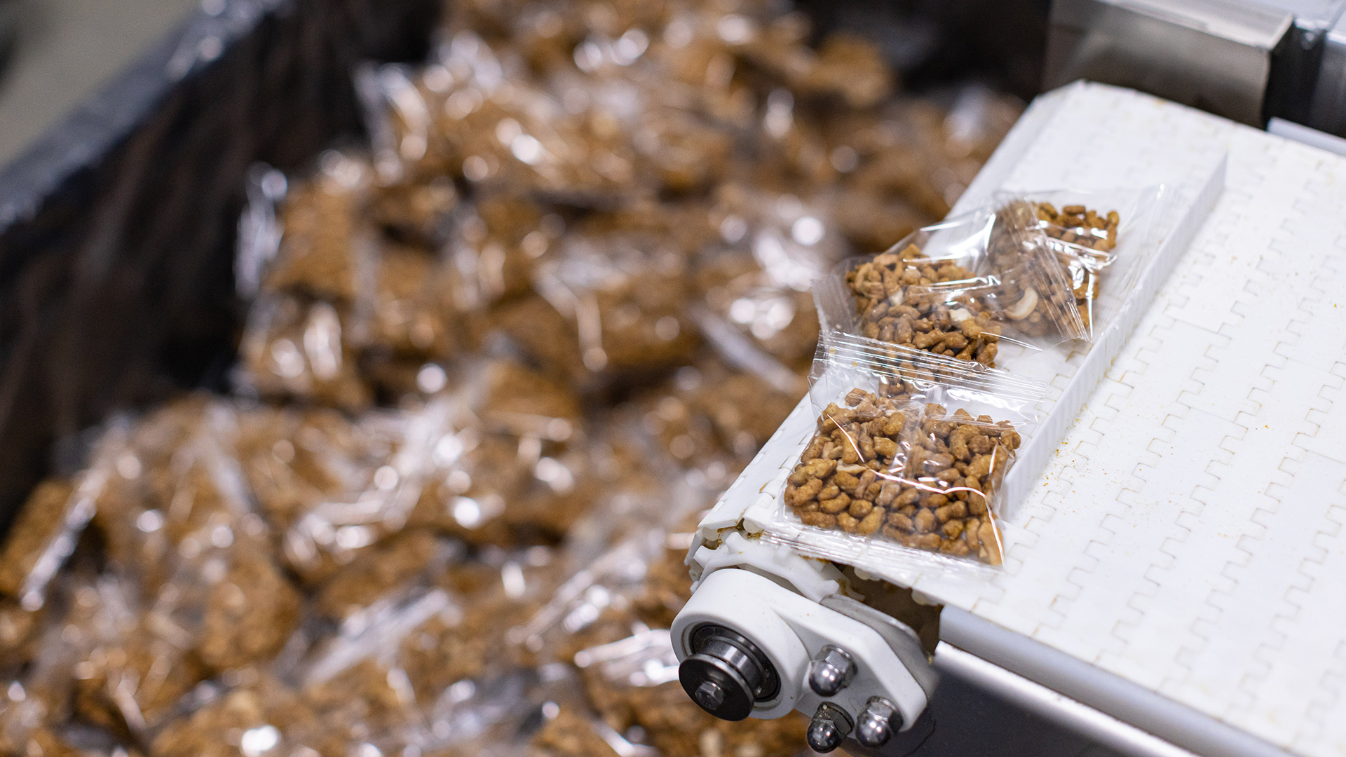 Packages of nuts on a conveyor belt